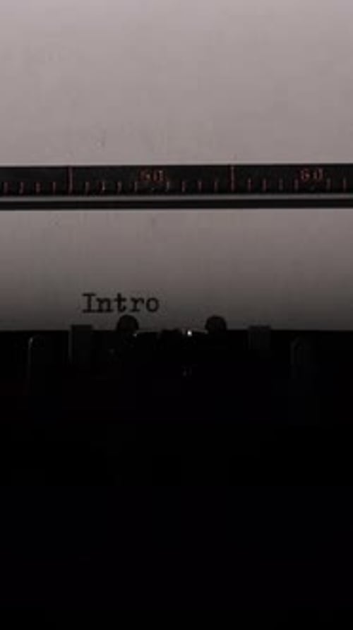 Vertical Video Vintage Typewriter Creating Fresh Text on a Sheet of White Paper Symbolizing New