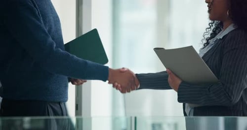 Business people, handshake and meeting in office with finance report, budget review or statement