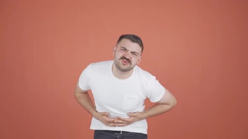 Man experiencing stomachache.