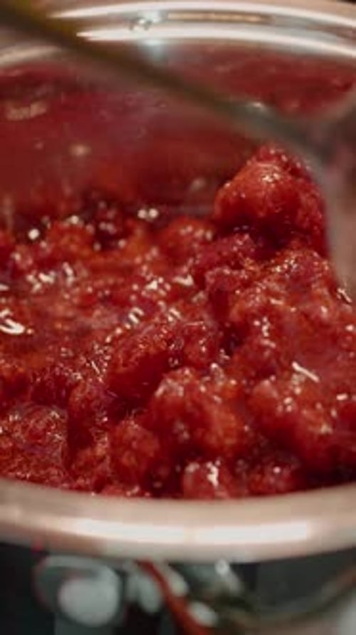 Raspberry Cooking Process in Pot with Spoon