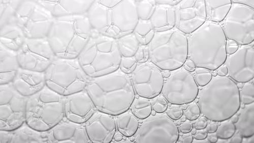 Mesmerizing macro close-up reveals delicate white bubbles. Stock footage.