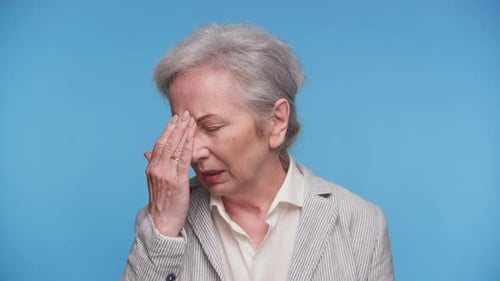 Senior Woman Experiencing Pain, Headache, Face Close Up