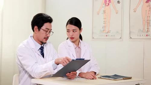 A group of healthcare team partners hospital medical doctor office, two young professional experts d