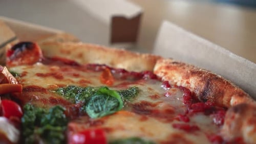 Delicious Pizza with Pesto in Cardboard Box