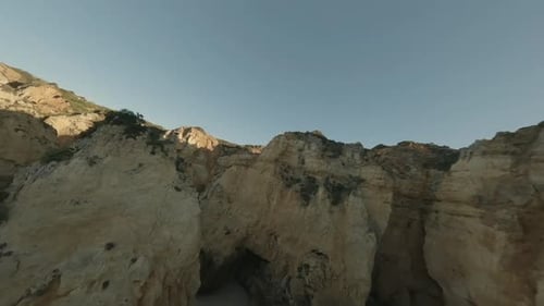 Proximity flying: Aerial navigates amid jagged Portugal shore cliffs