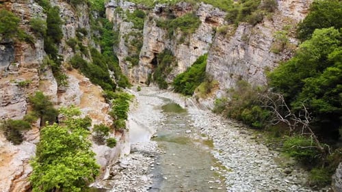 Flying on a Drone Over a River Through a Canyon in Albania