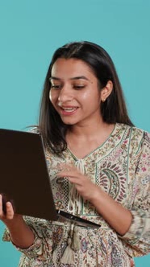 Young Woman Using Laptop for Video Call