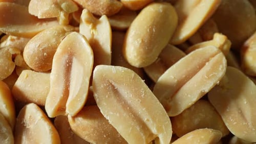 A macro shot of roasted peanuts.