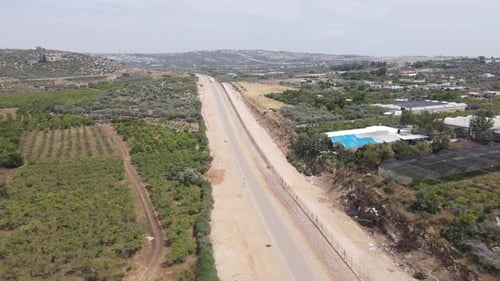 Highway to Israeli army defense base camp outskirts aerial