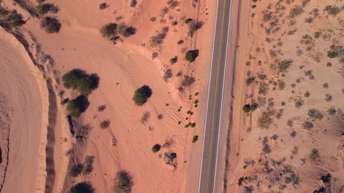 Aerial top view drone flying over route in the desert.