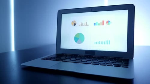 Laptop Displaying Data, Charts and Graphs