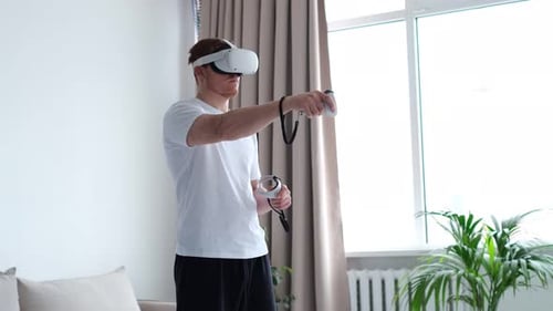 Man Using Virtual Reality Headset at Home