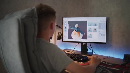 Teenage Boy Creates and Draws Clothes Using Design Software on PC
