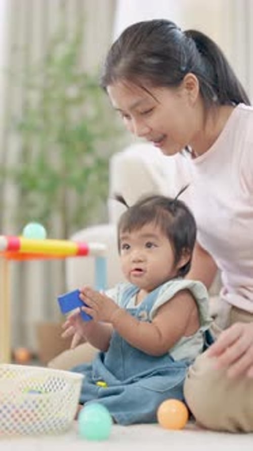 Mother and Baby Playing with Toys Indoors