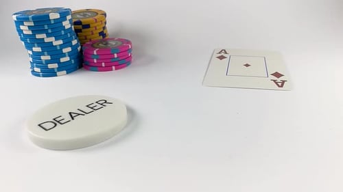 Poker Chips and Cards on White Surface