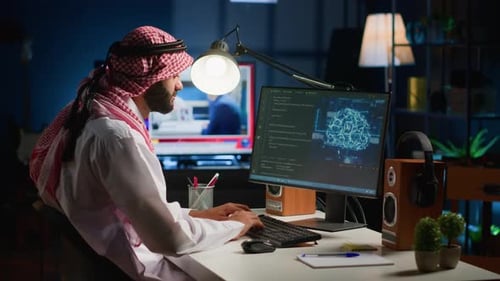 Young Adult Coding at Computer Late at Night