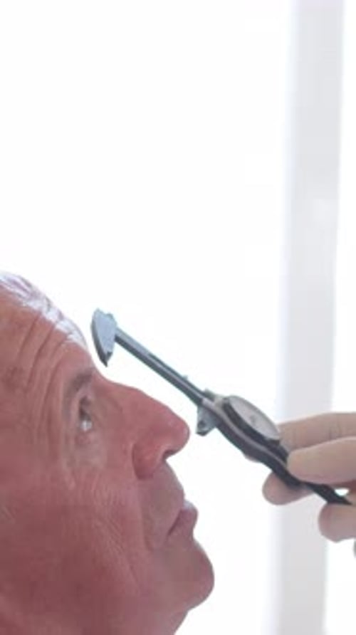 Preparation for Plastic Surgery on the Face of an Elderly Man Vertical Video