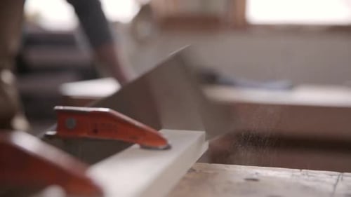 Carpenter Cutting Wood with Pull Saw in Workshop 3539 Years
