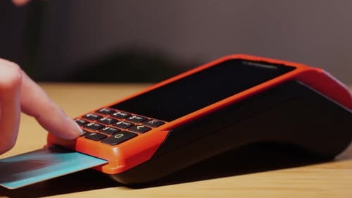 Hand Enters Numbers Into Pin Pad Machine