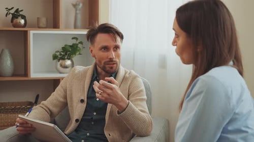Indoor Conversation Between Man and Woman