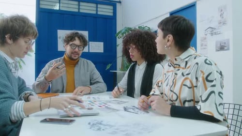 Team of Adults Collaborating on Design in Office