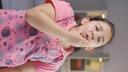 Vertical video of Girl child with toothache.