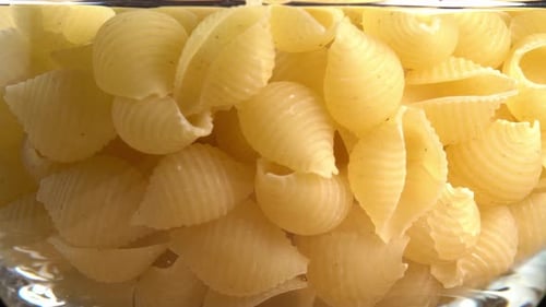 Uncooked Shell Pasta in a Glass Bowl