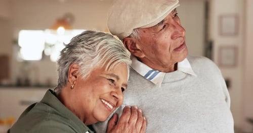 Senior Couple Embrace with Love Indoors