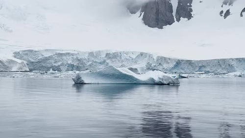 A Huge High Breakaway Glacier is Passing By in the Southern Ocean Off the Coast of Antarctica the