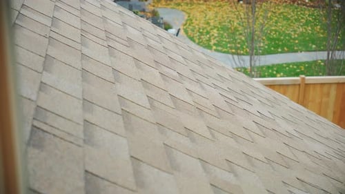 A New Roof is Installed on a House Move Camera View