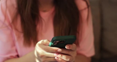 Woman Using Cell Phone Close Up in Home