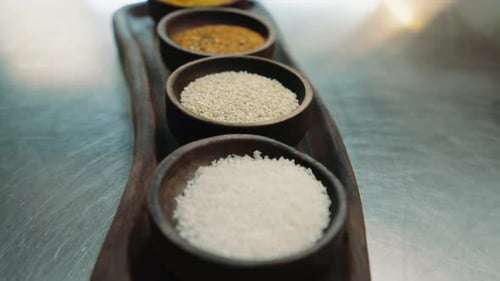 close-up of oriental spices standing on a metal counter in a professional kitchen in an restaurant