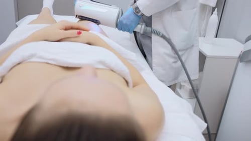 Woman Receives Medical Procedure in Bright Office