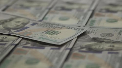 Overlapping Hundred Dollar Bills Close Up