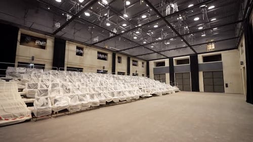 Empty Theater Hall, Seats Covered with Plastic Cover