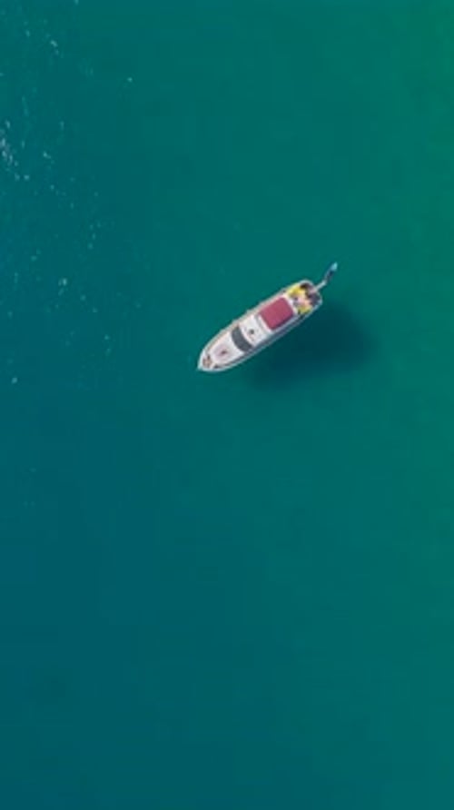 Boat Sailing on Turquoise Ocean Water