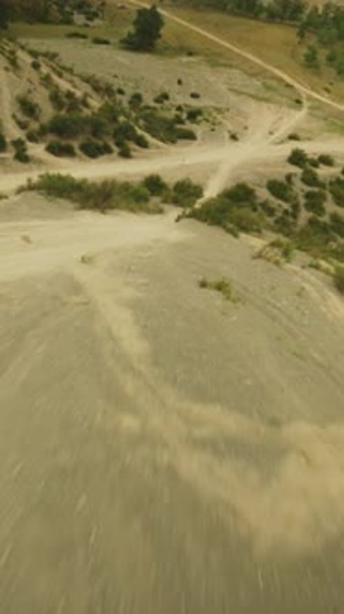 Dirt Motocross Tracks and Van in Hilly Valley Fpv