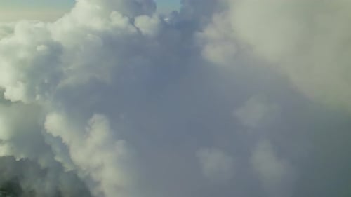 Cloud Formation Captures Breathtaking Aerial View at Sunset Near Coastal Area