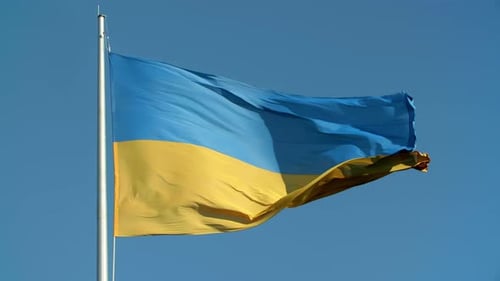 Ukrainian Flag Waving Against Blue Sky