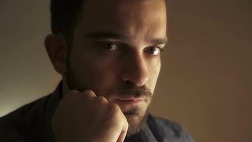Thoughtful Man with Beard Close Up Portrait
