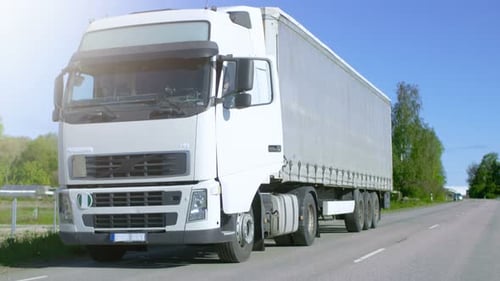White Freight Truck Parked on Side of Road