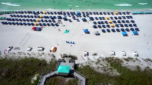 Hotel Resort view in Florida Beach Aerial chair and colorful umbrella beach service. Miami Beach, Fl