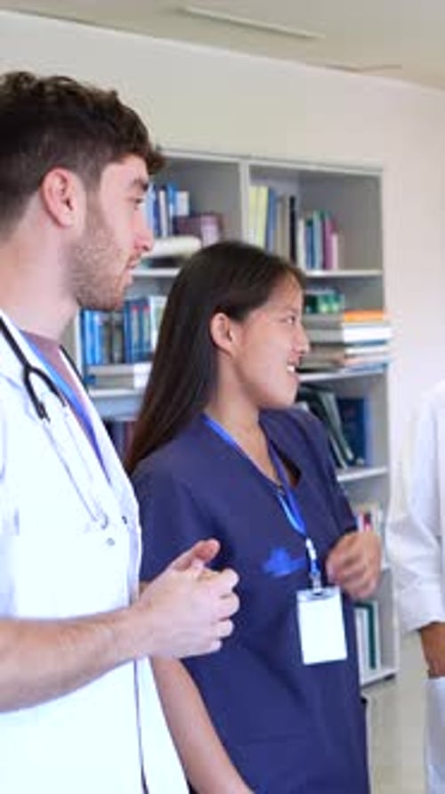 Medical Team Discussing Patient Cases and Treatment Strategies in Hospital