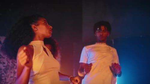 Young People Dancing in Nightclub Pair of African Man and Woman Moving Fast Clubbing and