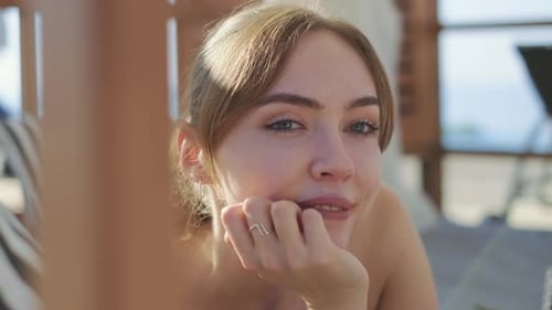 Closeup shot of a beautiful blonde female model smiling. stand outdoor relax,happy. slow motion. 4K