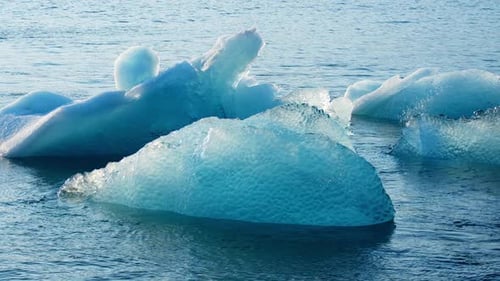 Blue Iceberg Floats in the Sea Pure Ice is Melting Jokulsarlon Glacier Lagoon