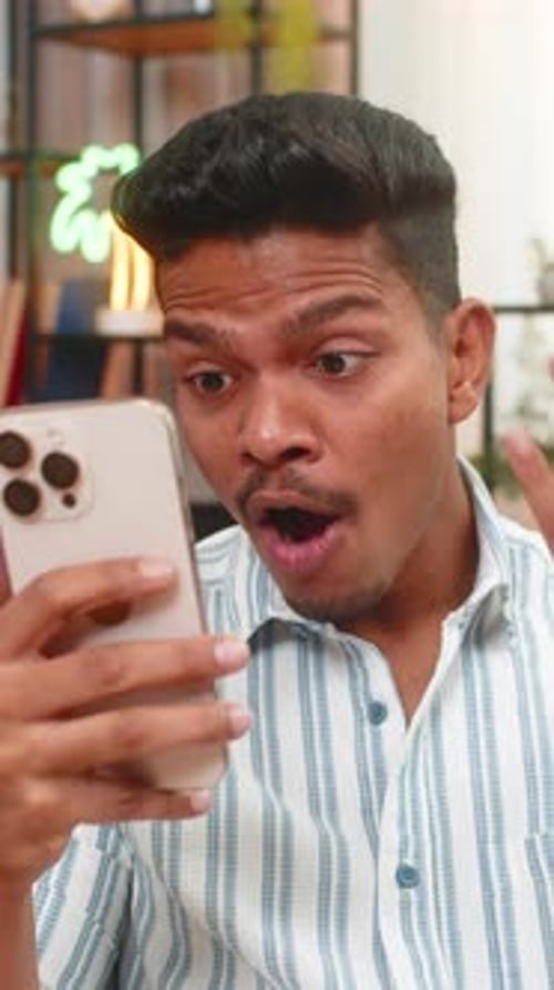Indian Man Scrolls Smartphone Feed Sees Big Discounts Says Wow Smiles at Online Shop Offers News Hot