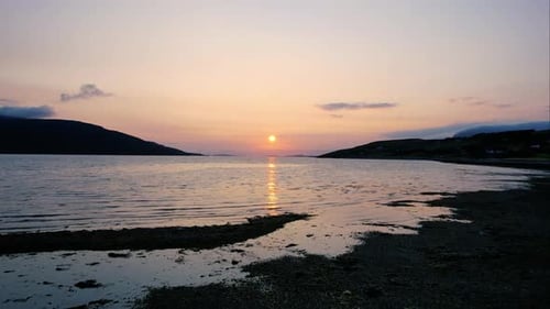 Sunset Over Calm Ocean Waters at Dusk