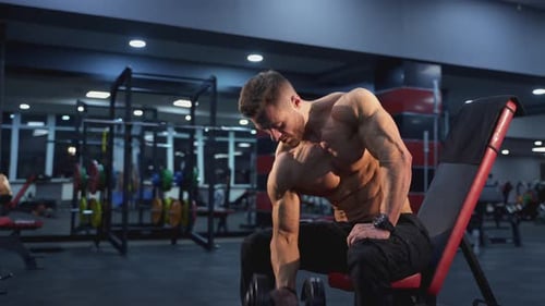 Man Weightlifting in a Gym