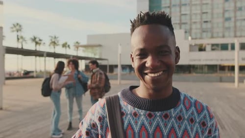 Close-up of a young man looking at the camera and smiling